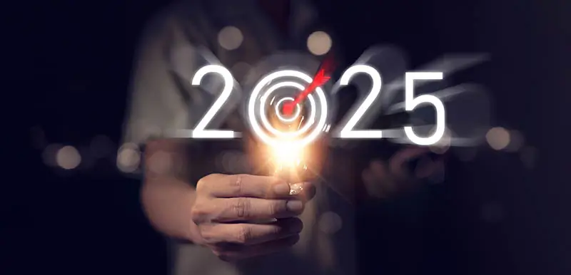 A futuristic "2025" with an arrow in the bullseye of the 0 and lights all around